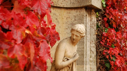 Statue of Roman Goddess Diana surrounded by autumn colour